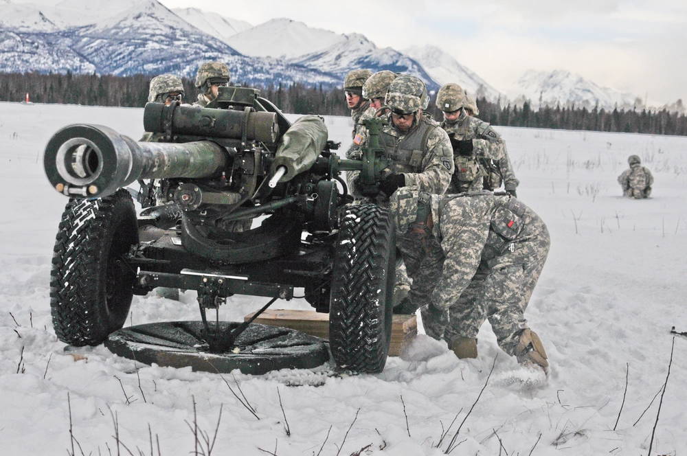 U.S. Soldiers with the 2nd Battalion,377th Parachute Field Artillery Regiment, 4th Brigade Combat Team (Airborne), 25th Infantry Division, prepare a M119 A3 105 mm Howitzer and ready it to fire just after de-rigging it from its heavy-drop platform March 7, 2013, at the Malemute Drop Zone at Joint Base Elmendorf-Richardson, Alaska. (U.S. Army Photo by Staff Sgt. Jeffrey Smith/Released)
