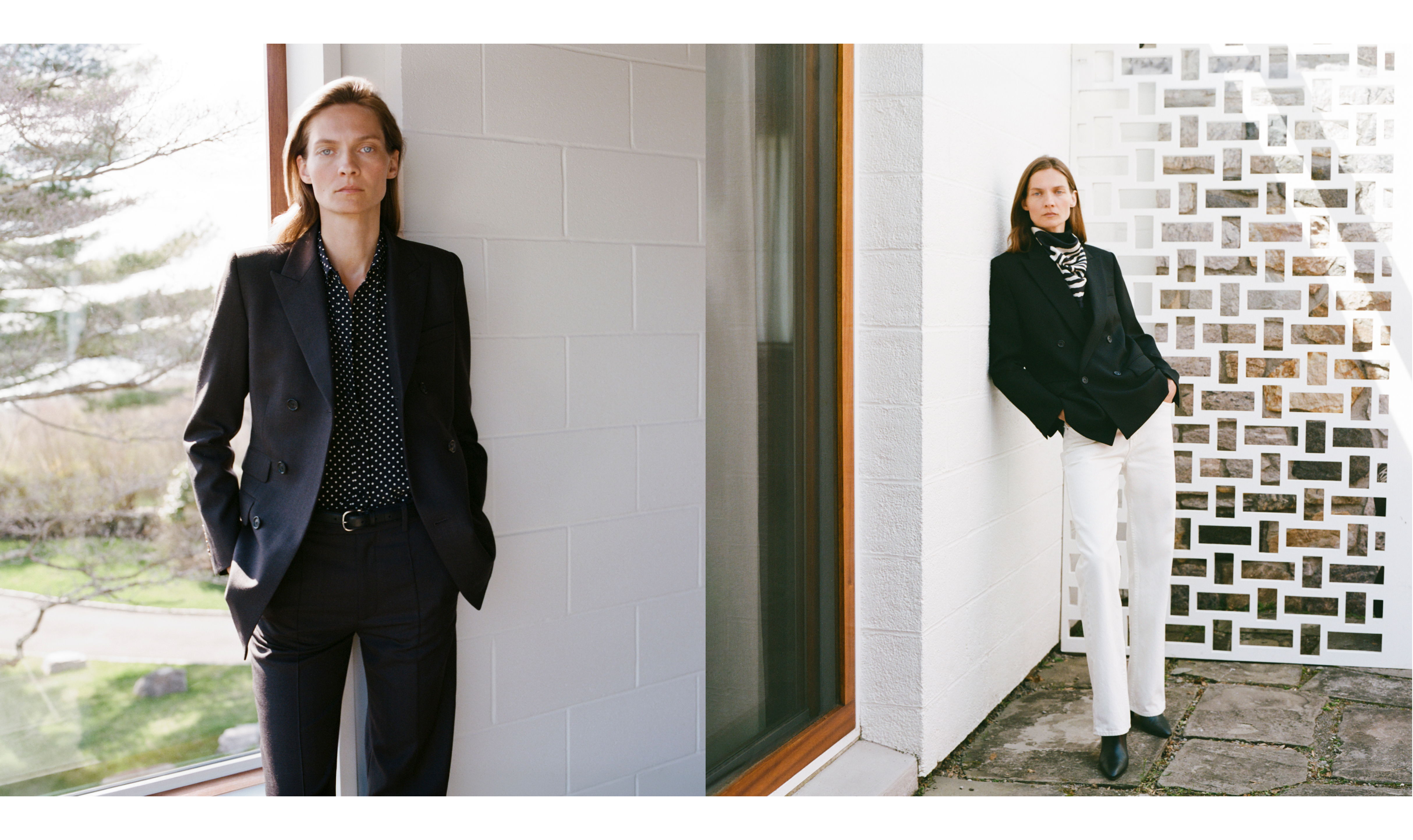Two women in stylish suits posing indoors against modern backgrounds.