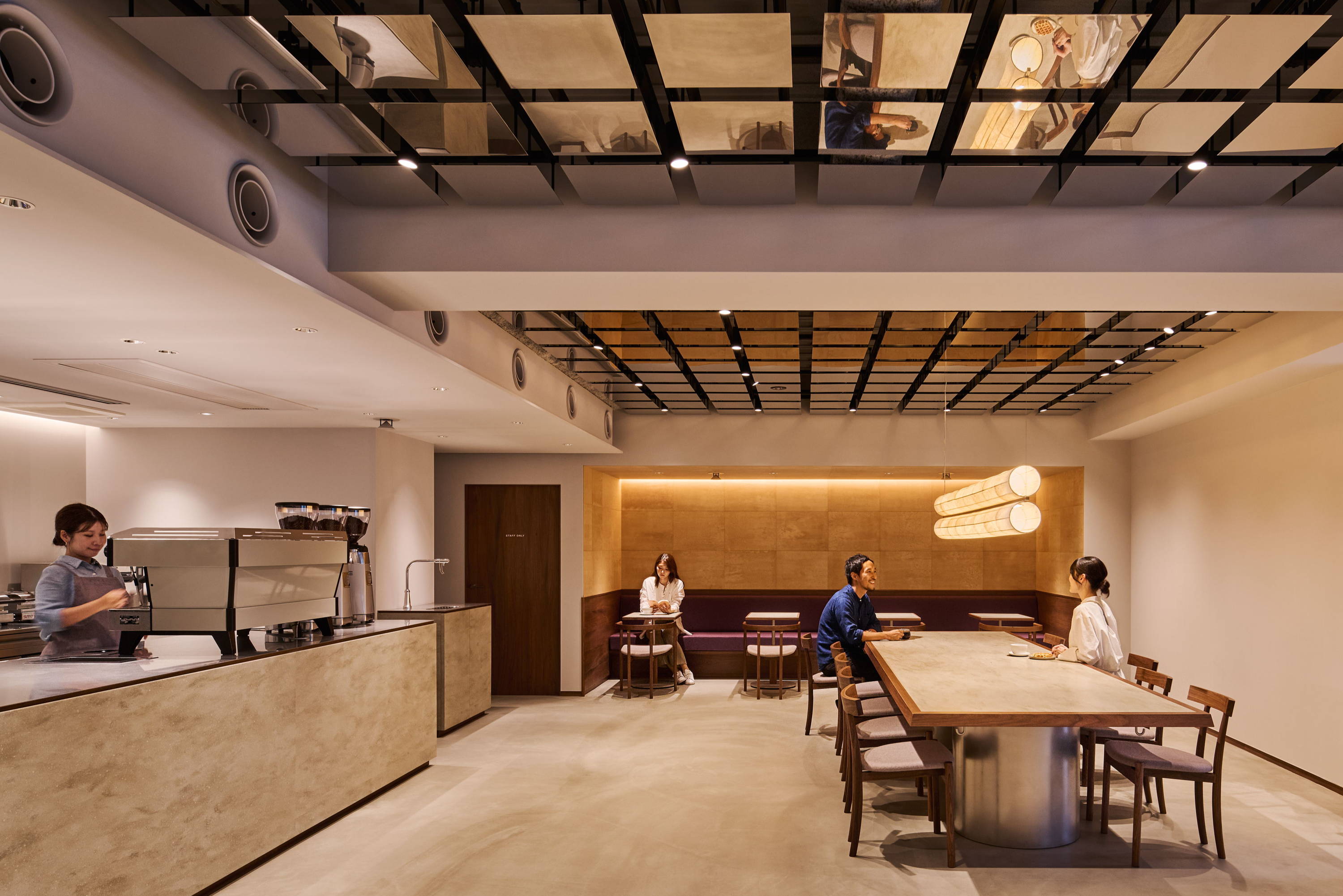 Modern interior of a cafe with wooden furniture and spacious layout.