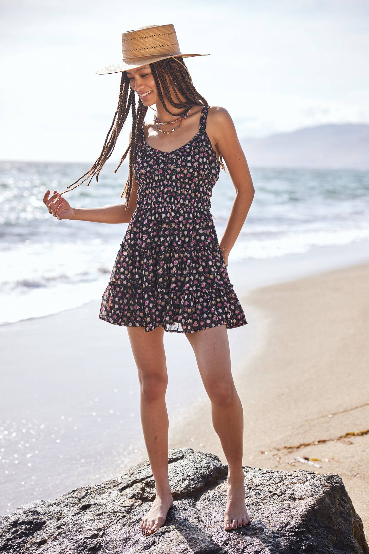 Trixxi sun-kissed summer, girl at oceanside beach sane in ditsy floral tier tank dress.