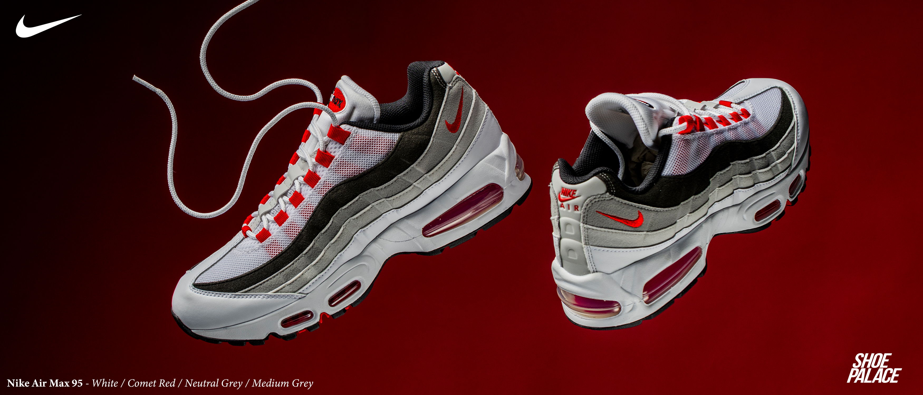 Nike Air Max 95 sneakers in white, black, and red on a gradient background.