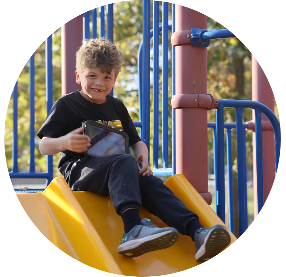 Nate on a slide with a Talk Pad Wego 8.