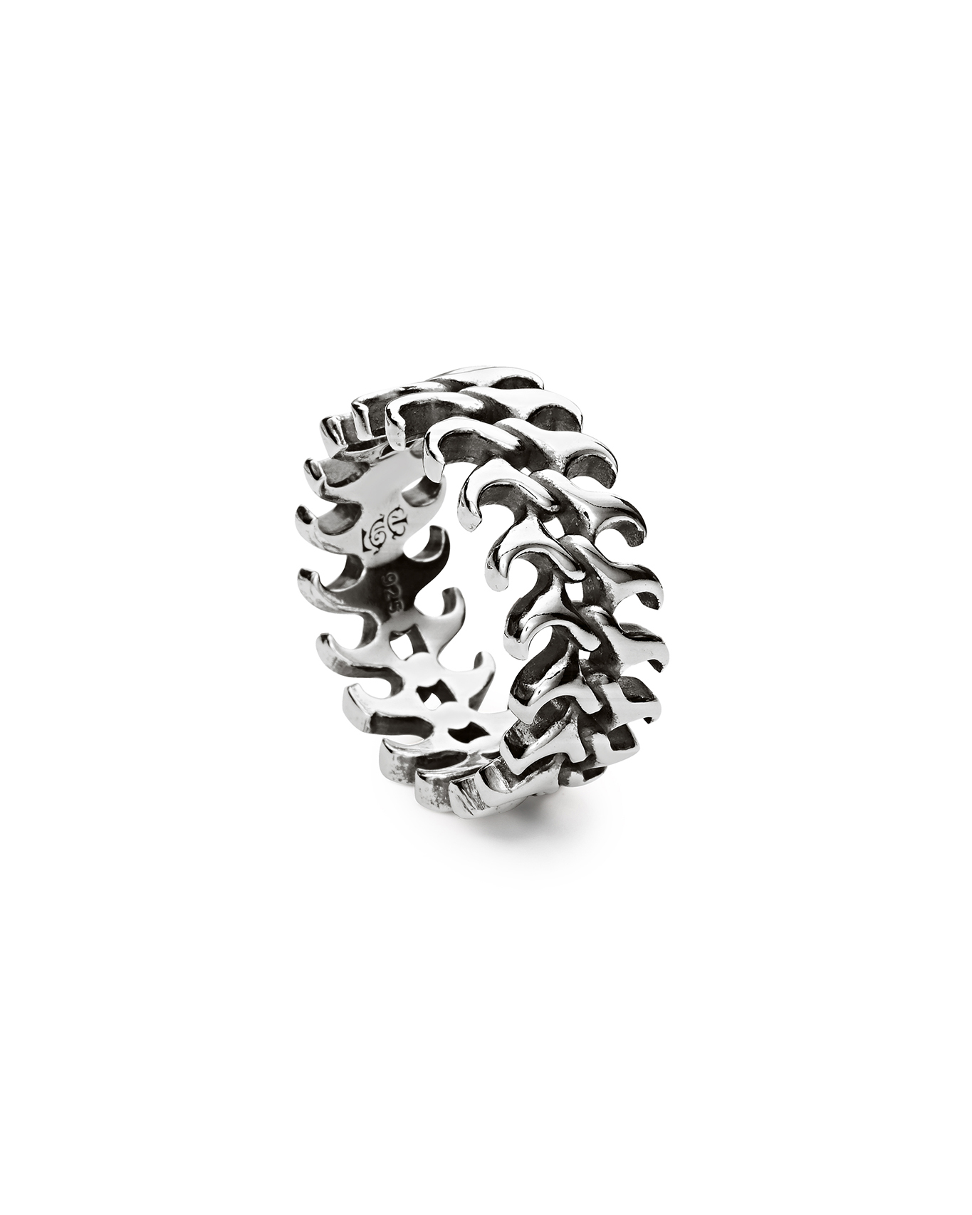 Silver decorative ring with a wavy design.