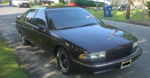 Front-three-quarter maroon 1996 Chevrolet Caprice full-size sedan BFGoodrich white-letter tires Jack's Conductor's Special 232 train horn kit featured customer install gallery photo 1