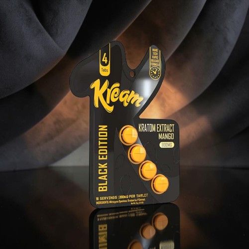 Kream Black Edition packaging with orange accents on a reflective surface.