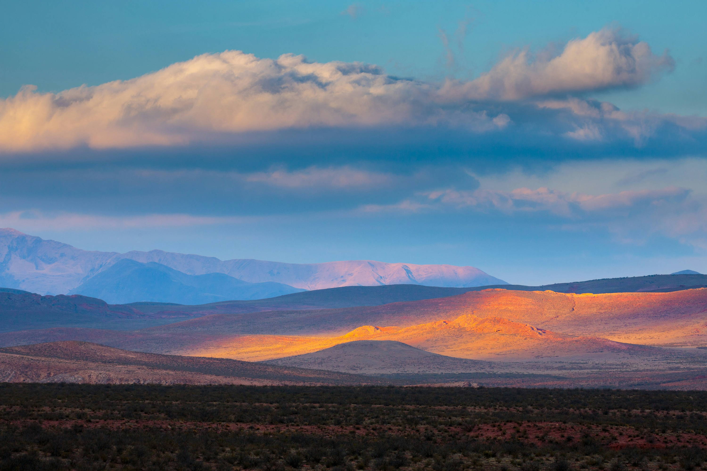 Nature photography of a mountain landscape and sky.