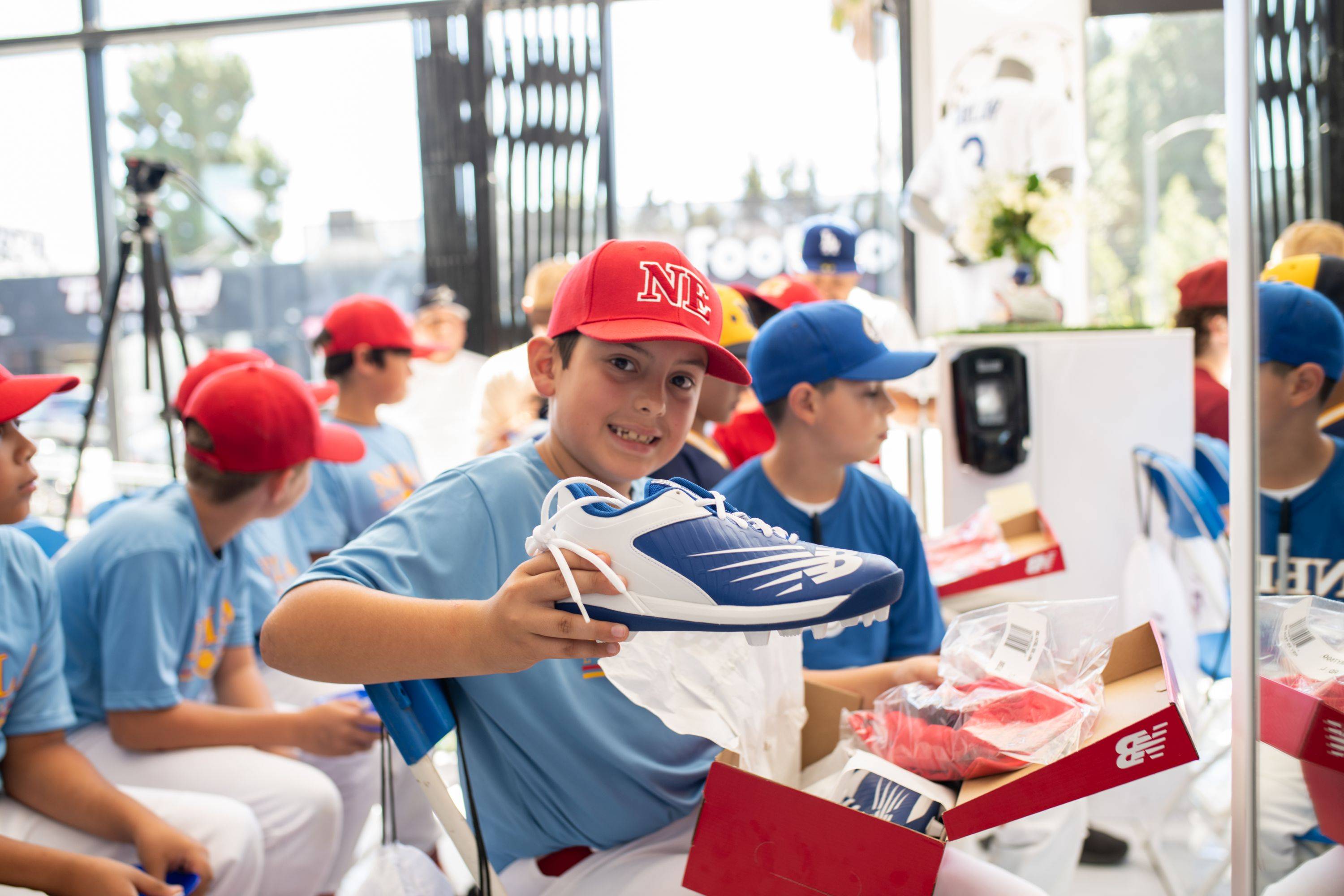 kid showing off new balance shoes