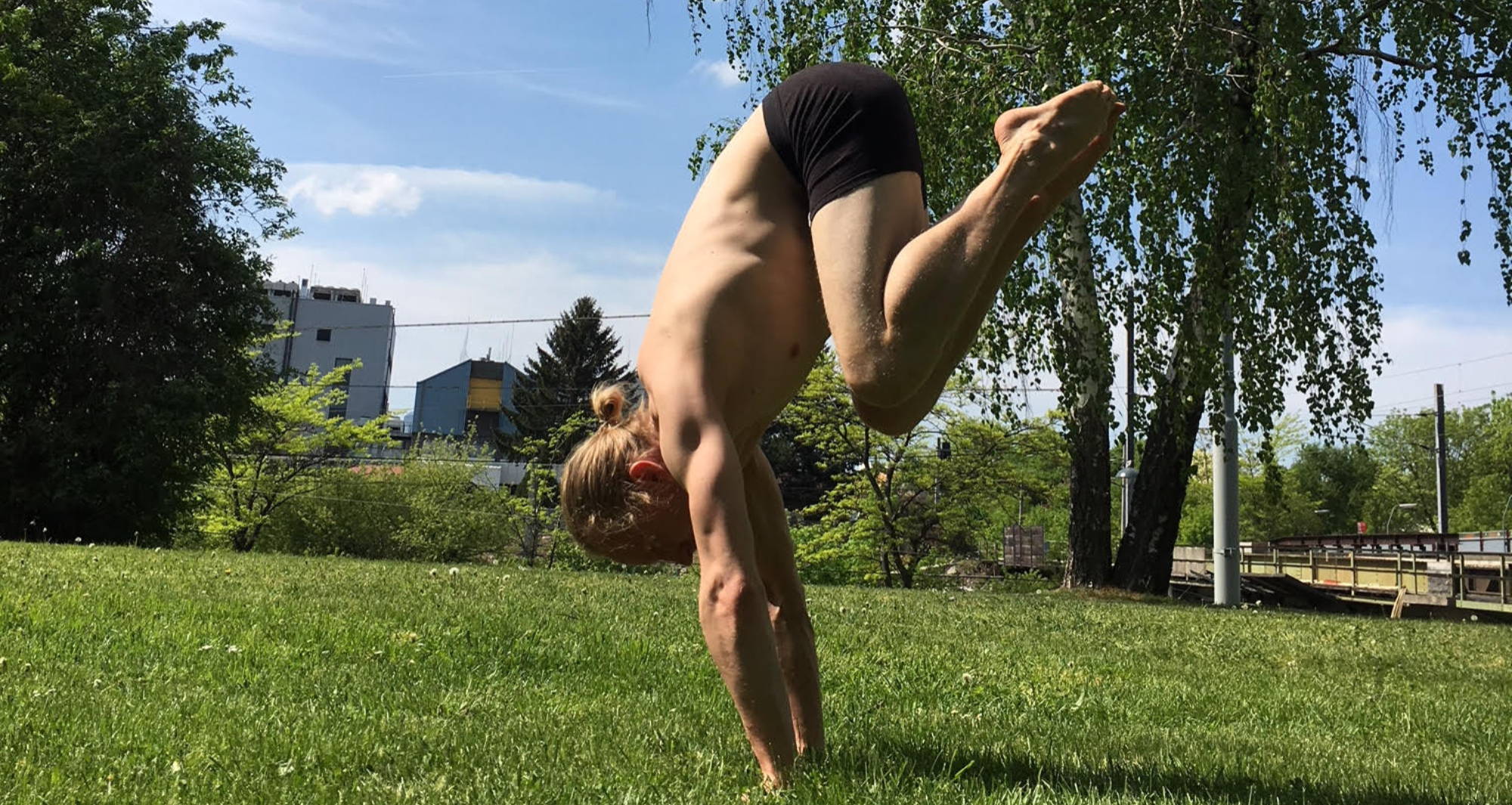 What to wear under yoga pants? A man wears WAMA hemp trunks to do a handstand.