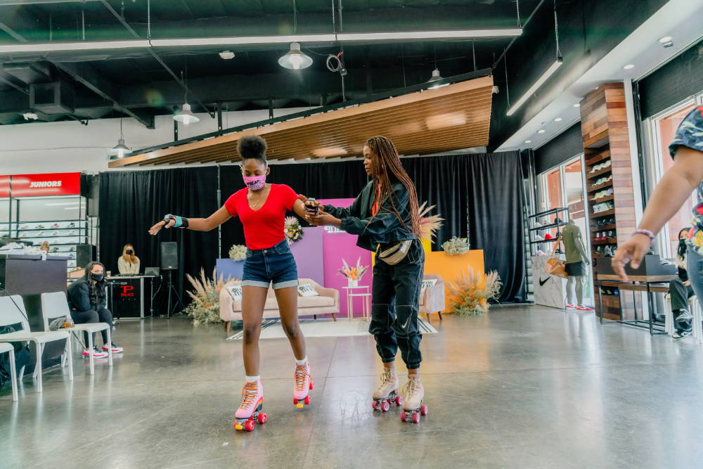 kamry james helping girl skate at for her event