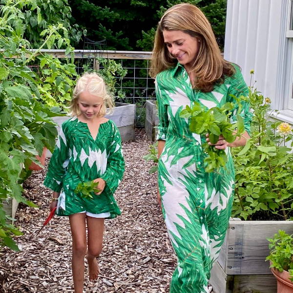 Chenault James wearing the Kathe Dress in Queen Palm and her daughter wearing the Penny Tunic in Queen Palm by Ala von Auersperg