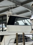Peter's Salthouse Sovereign 60 docked under covered marina with horns on upper deck photo 3