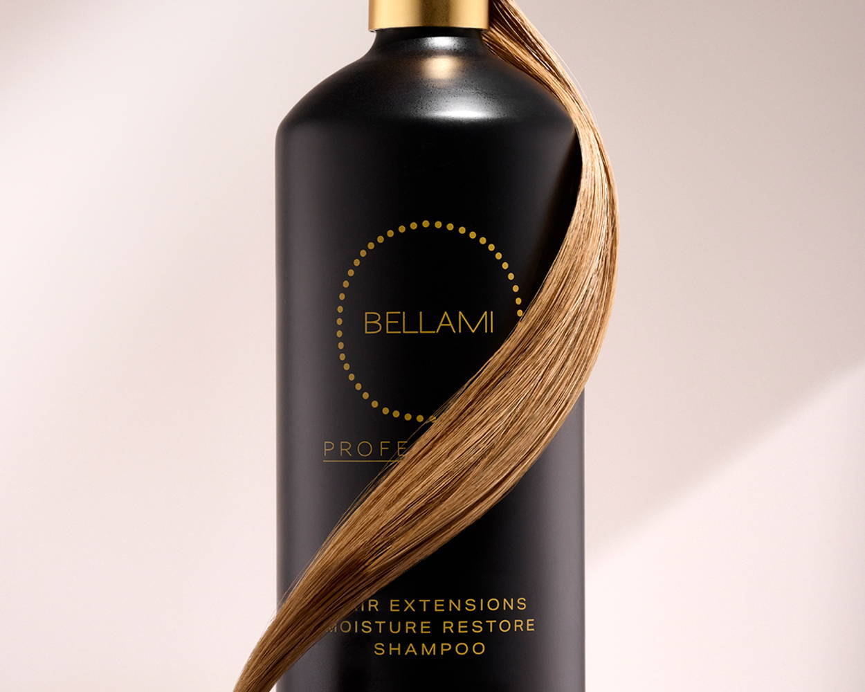 Bellami Professional Hair Extensions Moisture Restore Shampoo bottle with a strand of blonde hair wrapped around it.