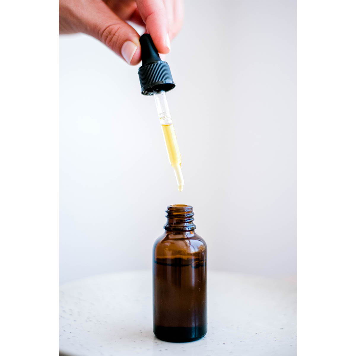 Dropper bottle with oil
