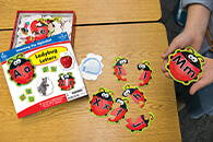 Ladybug Letters Hands on Learning Game in child's hand