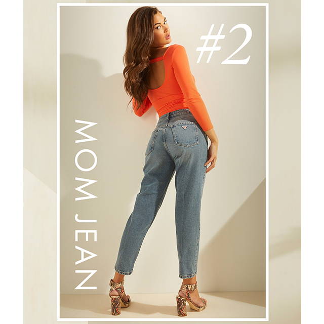 A woman wearing mom fit denim jeans