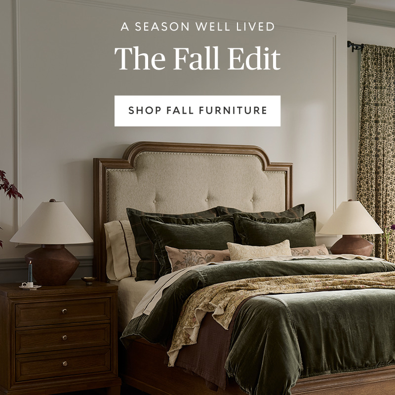 Hero banner featuring a rustic wood bed with layered green and neutral bedding in a bright bedroom. Promotional headline for The Fall Edit collection.
