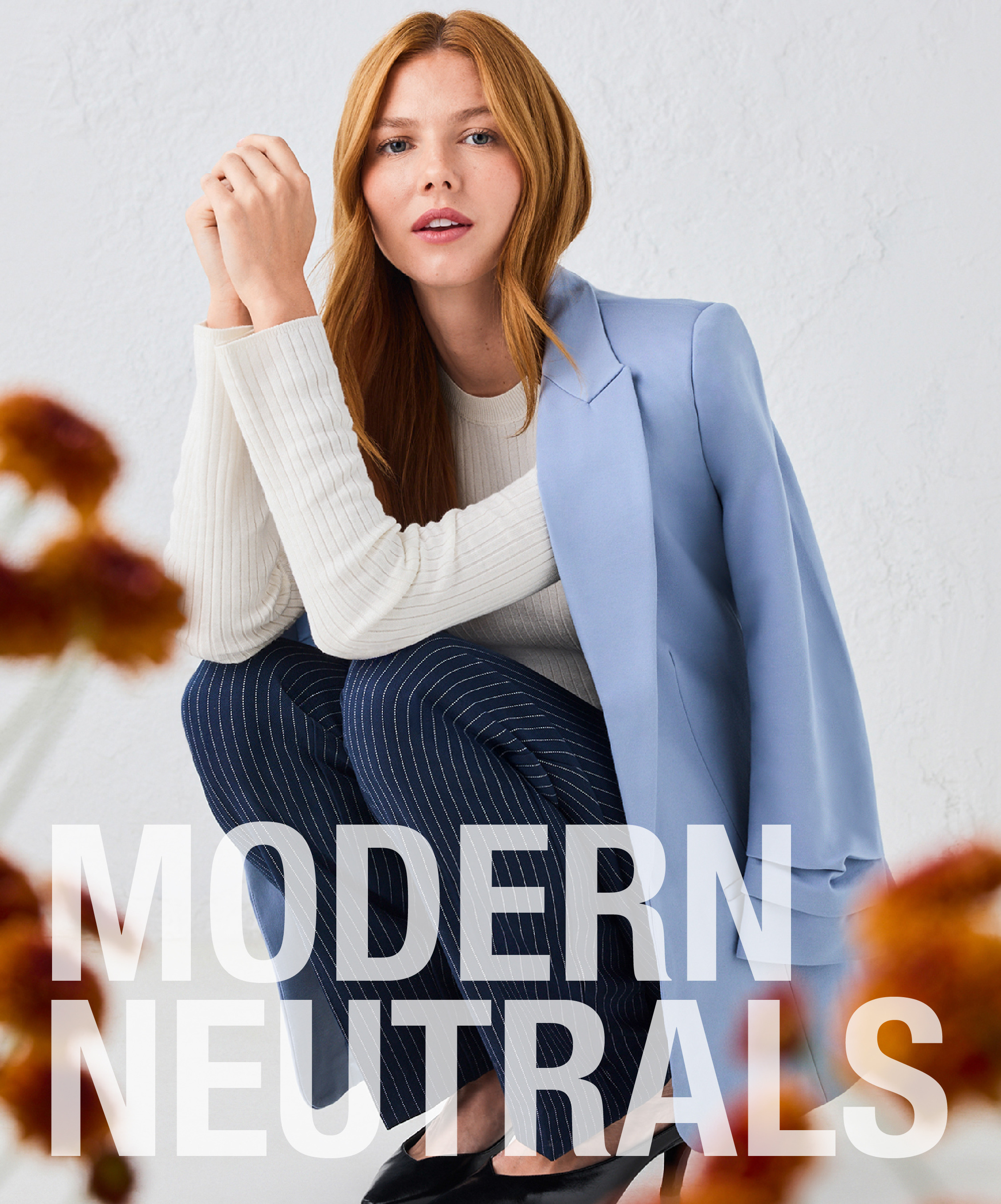 A woman in a blue blazer poses with text 