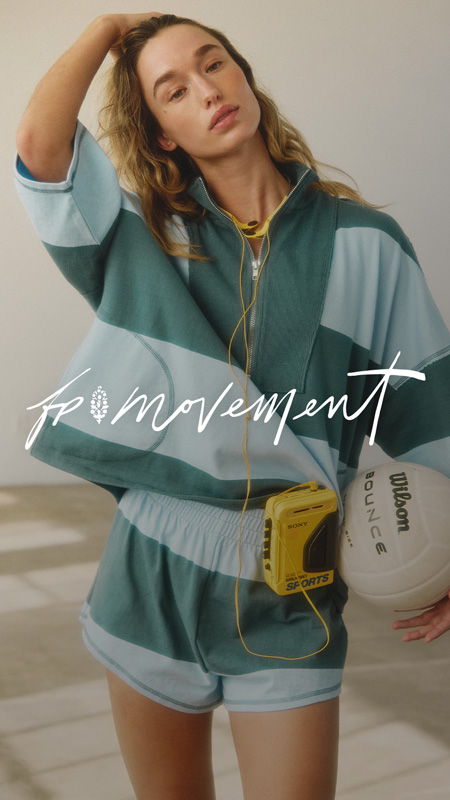 Model in stylish athletic wear holding a volleyball, with vintage cassette player.