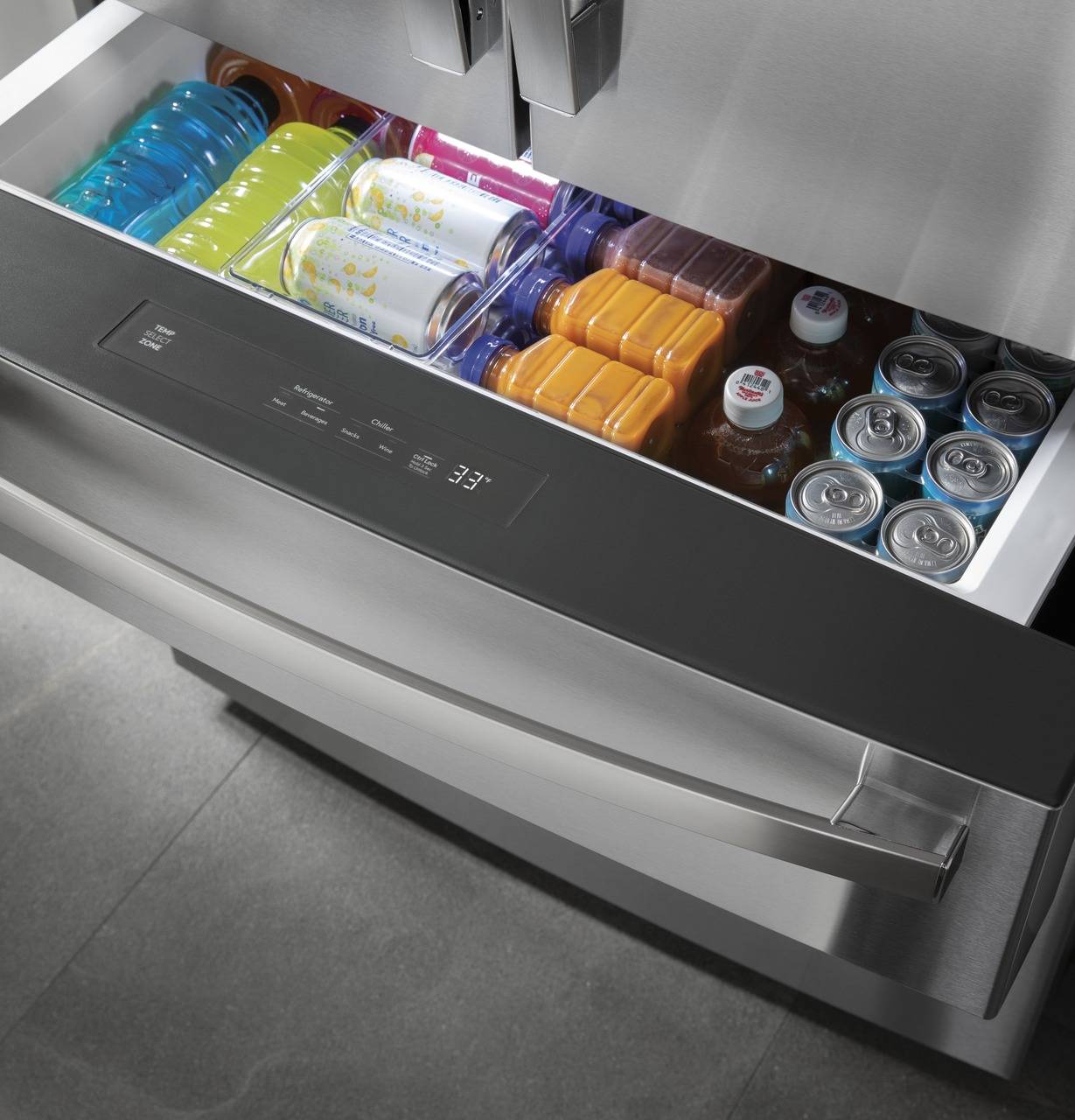 Adjustable temperature refrigerator drawer stocked with drinks.