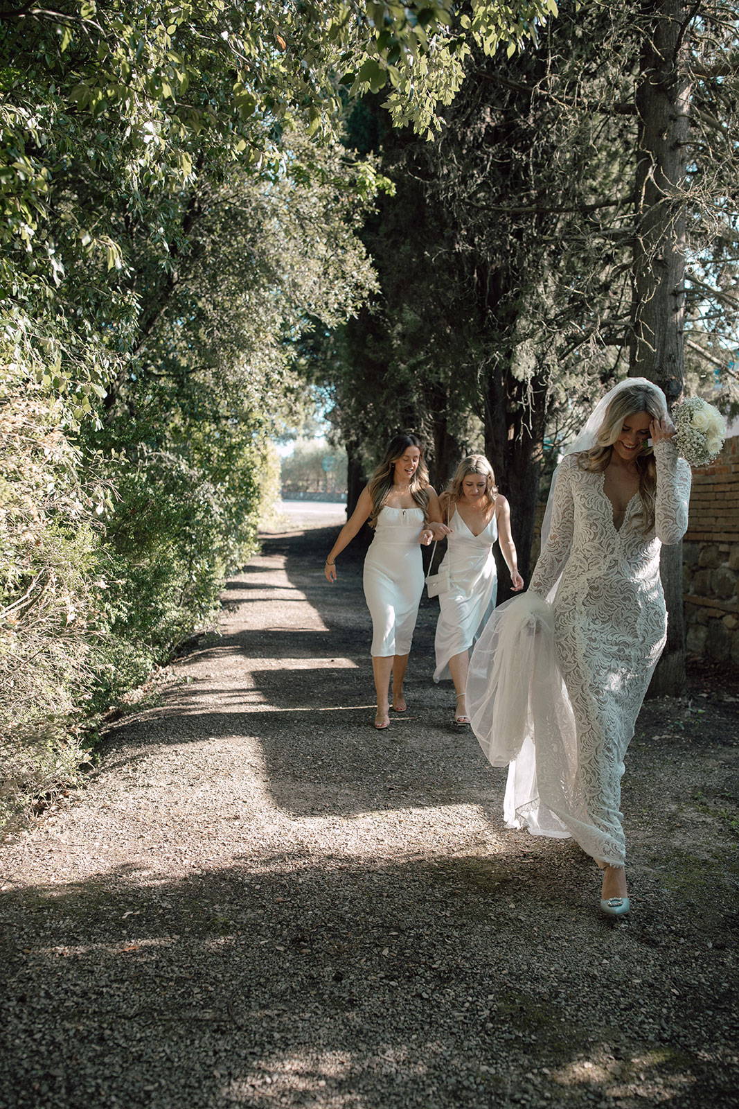 Bride with Bridesmaids amongst forest trees