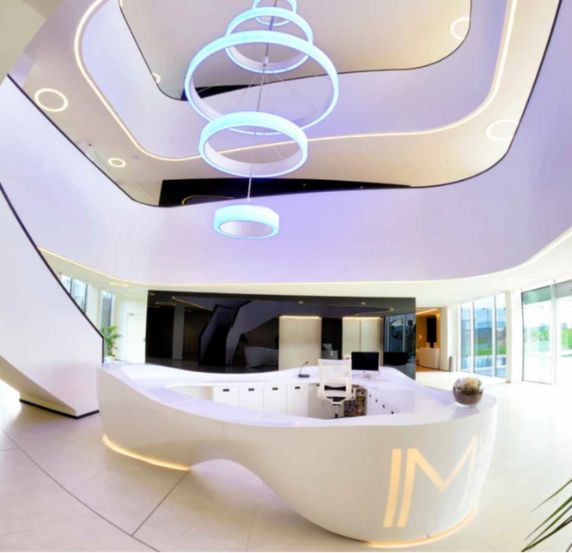 Modern Krion reception area with unique lighting and a sleek design.