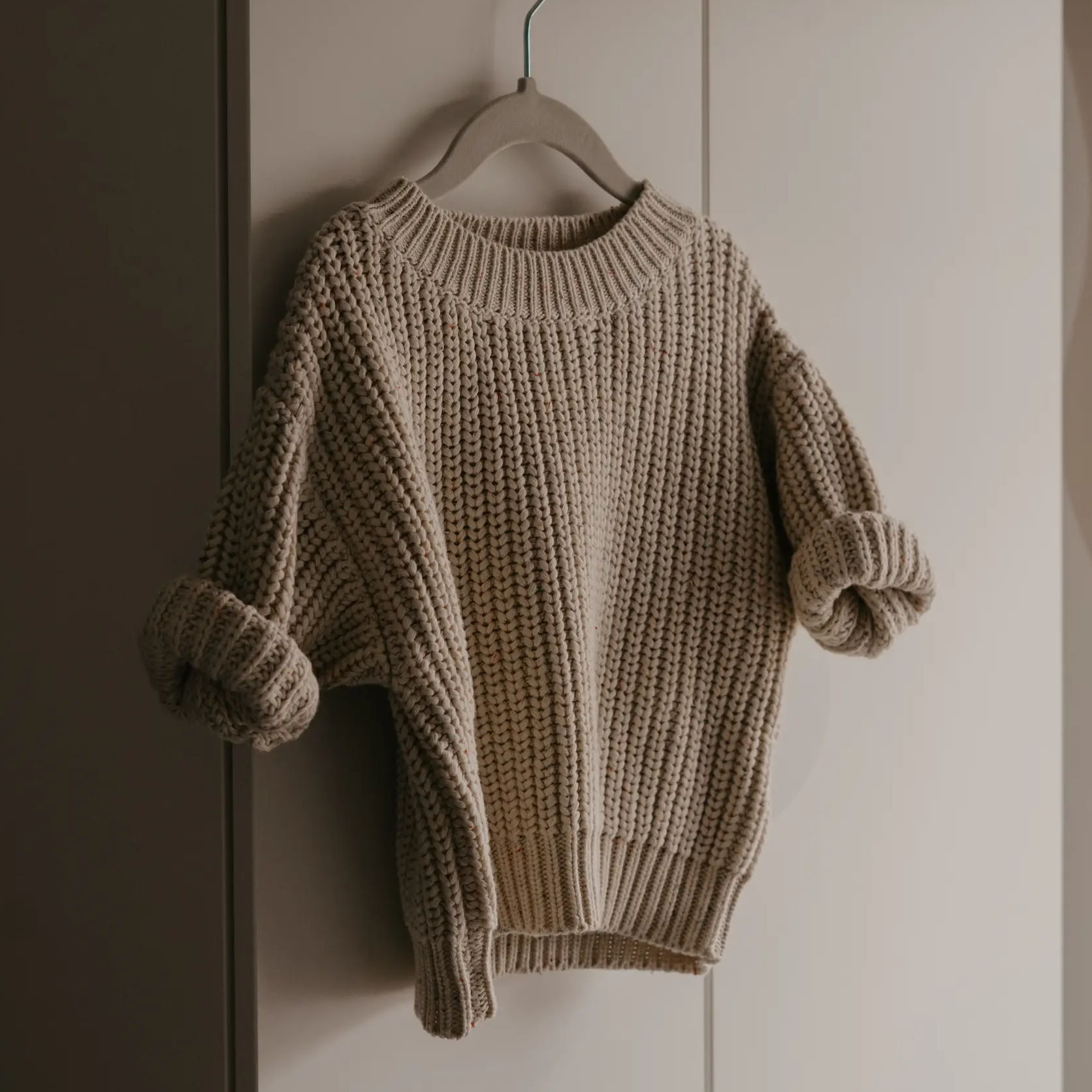 Image of a sweater on a hanger