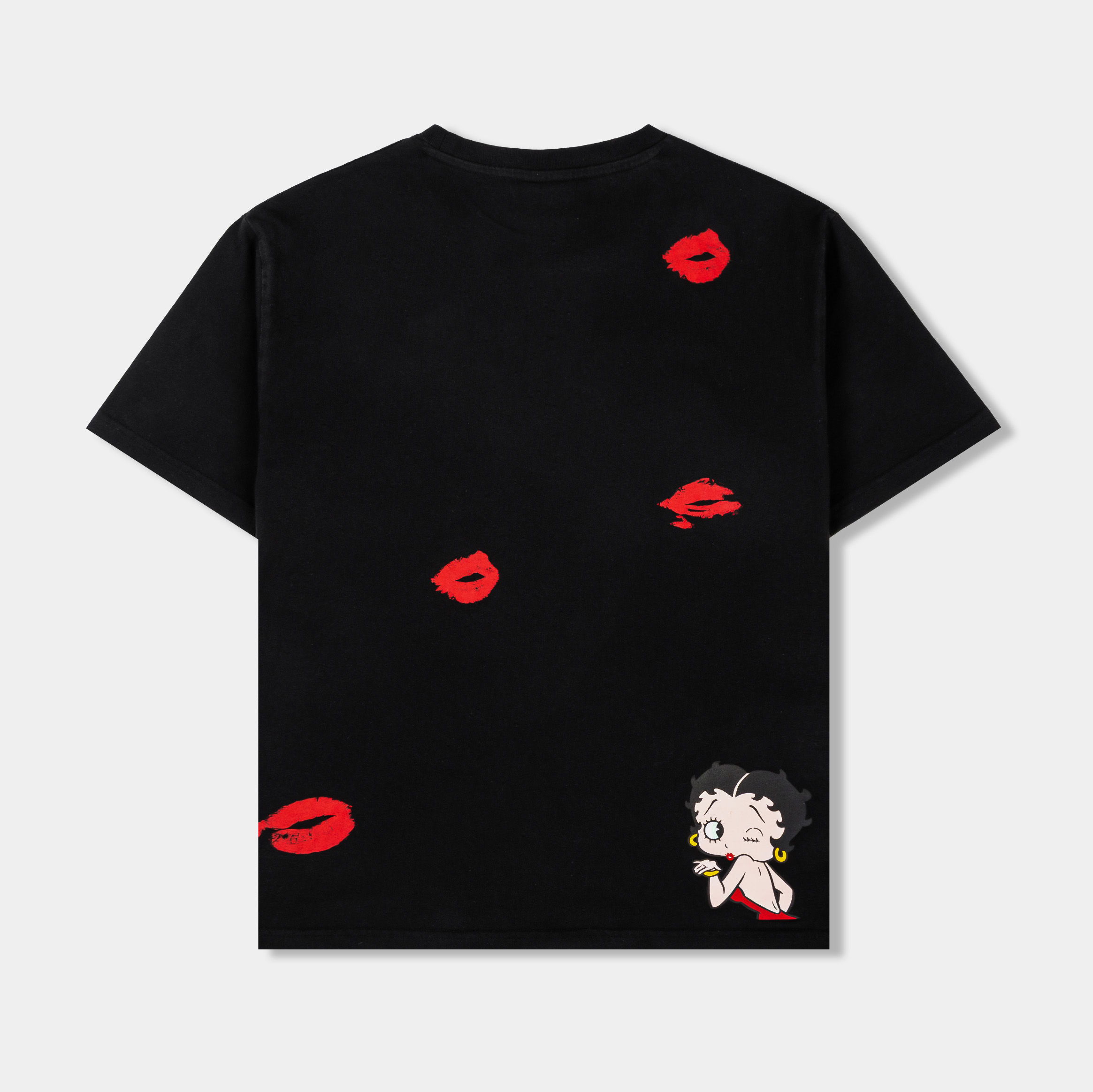 Black t-shirt with red lips graphic design and yellow text.
