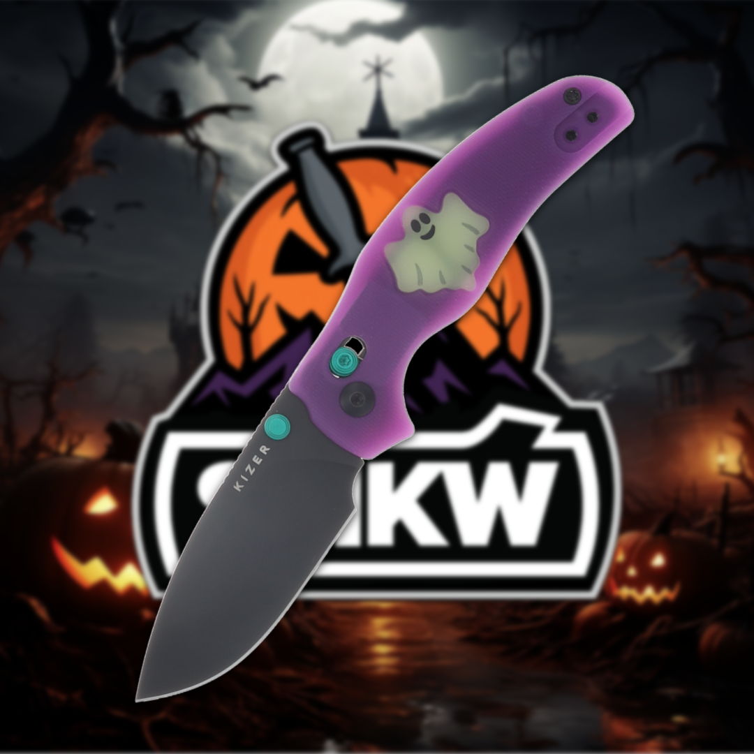 A purple folding knife with a spooky Halloween background.