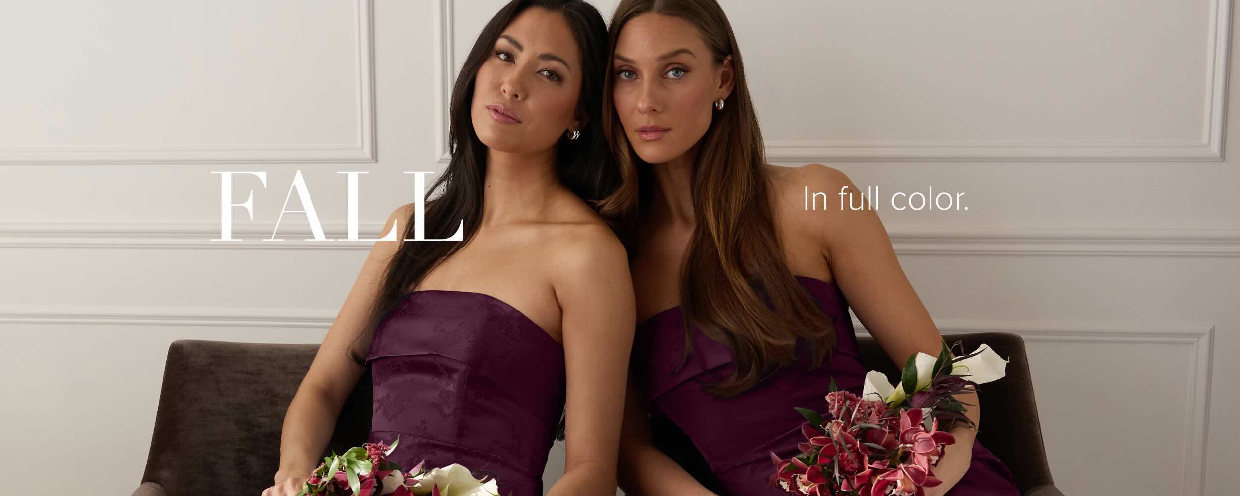 Two women in purple dresses holding bouquets, with 