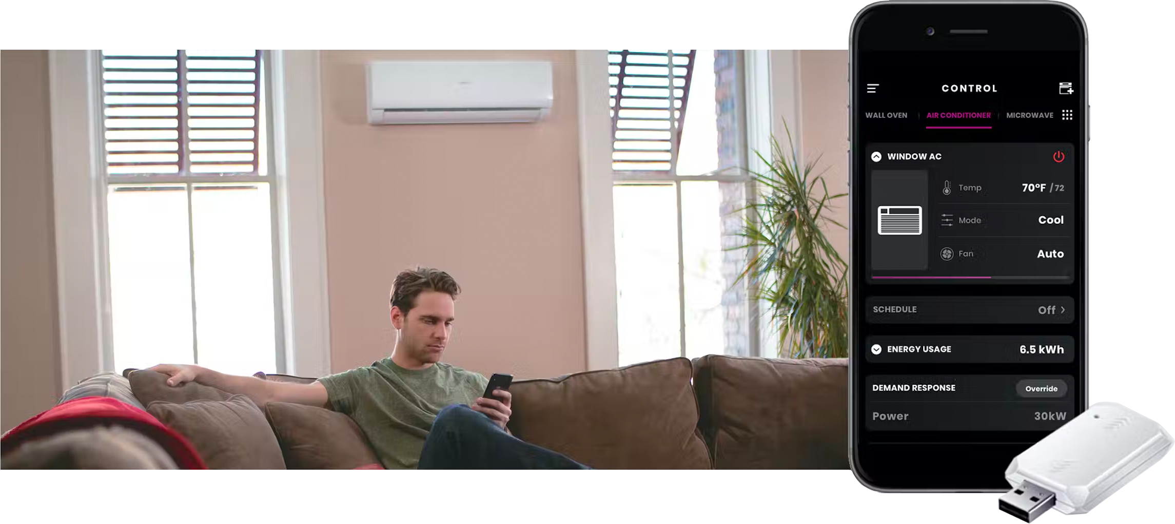 Man sitting in living room with ductless air system installed, and smartphone showing Smart HQ app