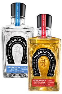 Two bottles of Herradura tequila, one silver and one reposado.