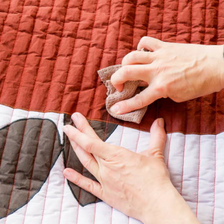 Blot Stain on Quilt with a Damp Cloth