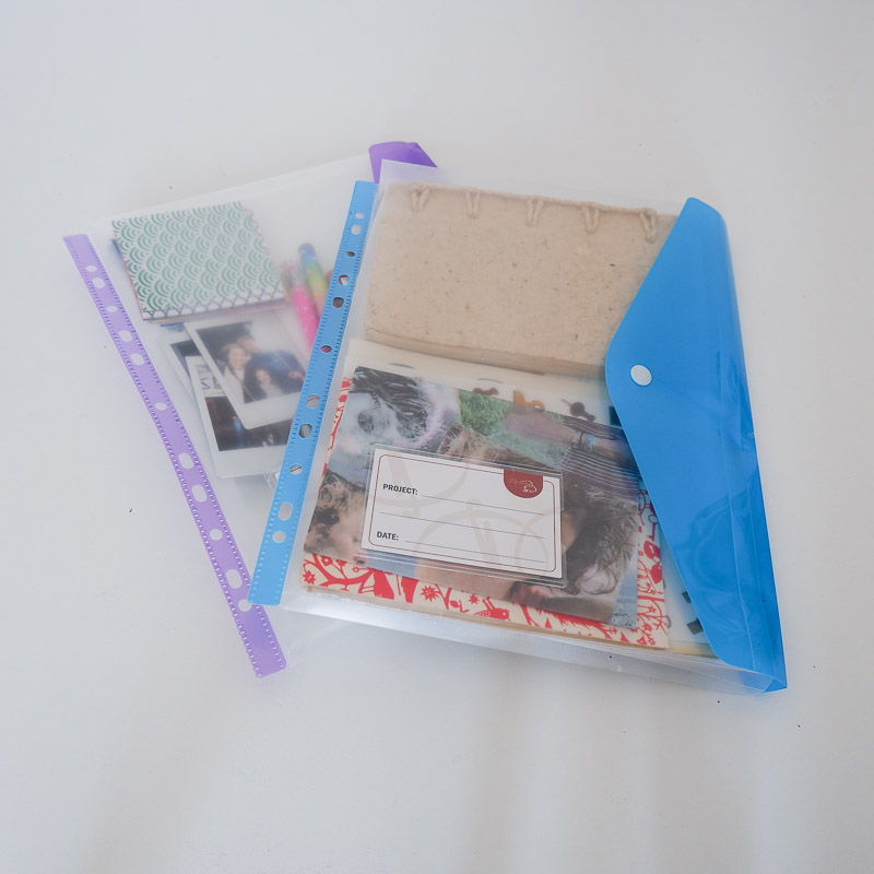two binder pockets with craft supplies