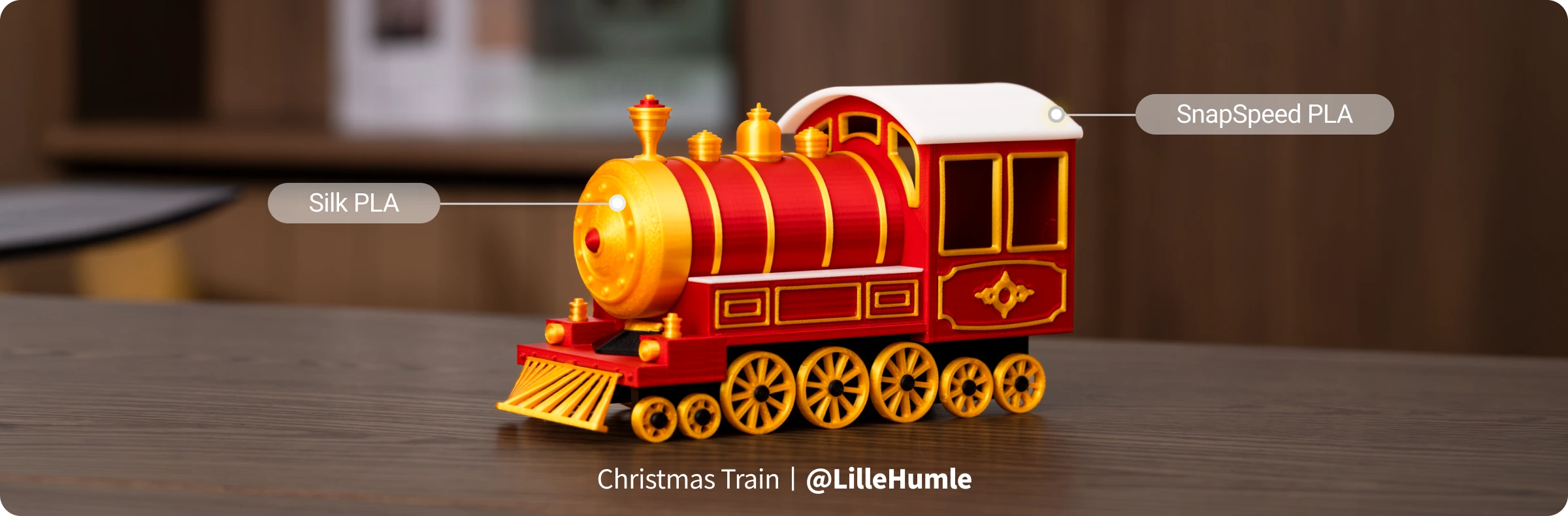 Colorful toy train on a wooden surface with labels.