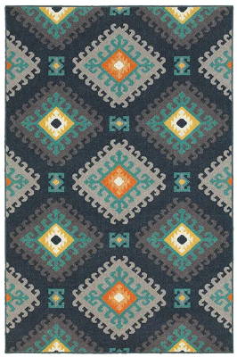A rug featuring a cascading diamond pattern in light blue to yellow.