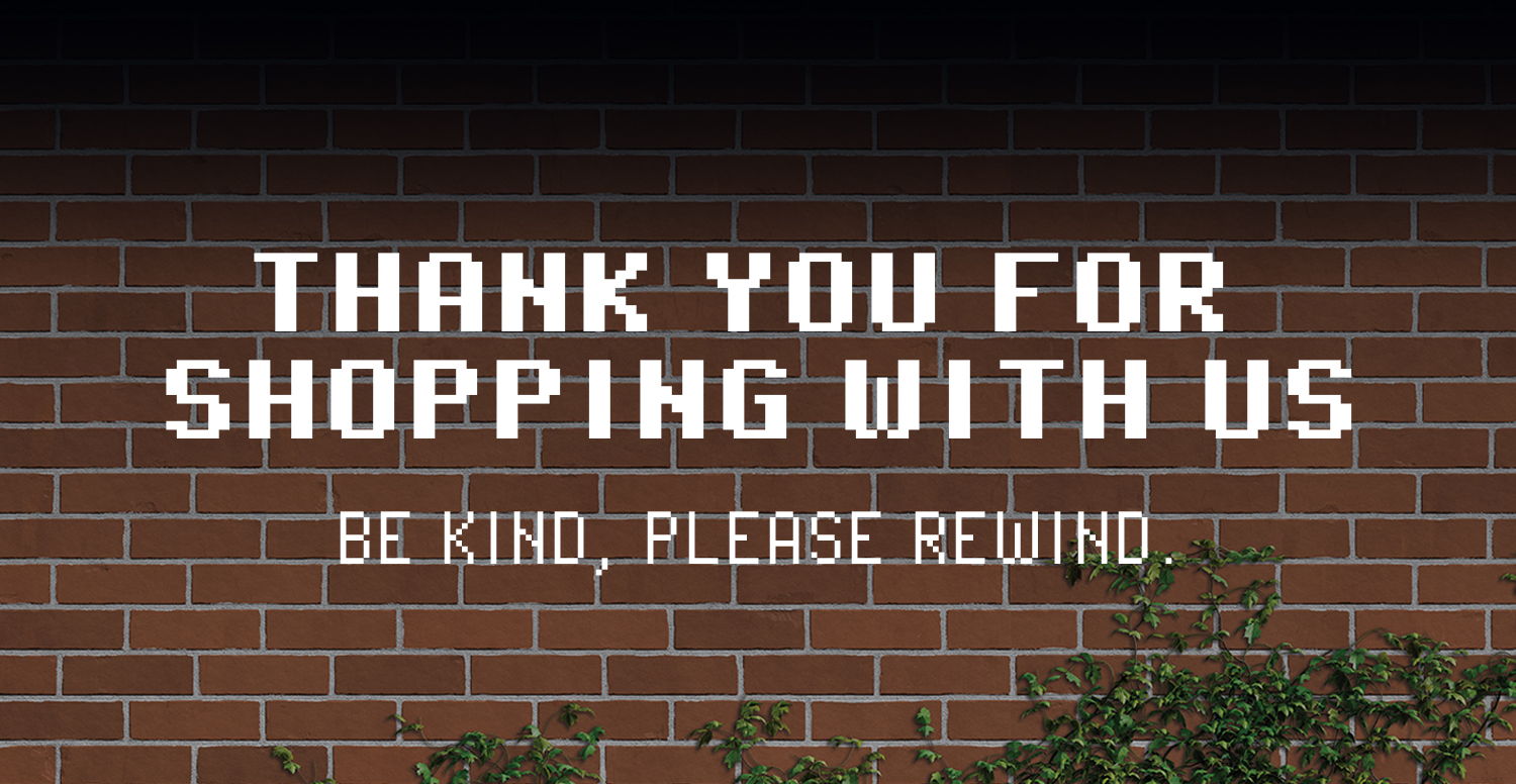 Text on a brick wall thanking customers and asking them to rewind.