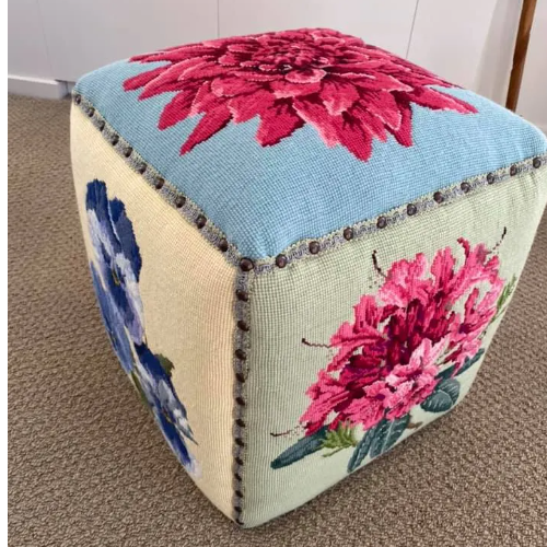 Multicolored floral needlepoint cubed foot stool
