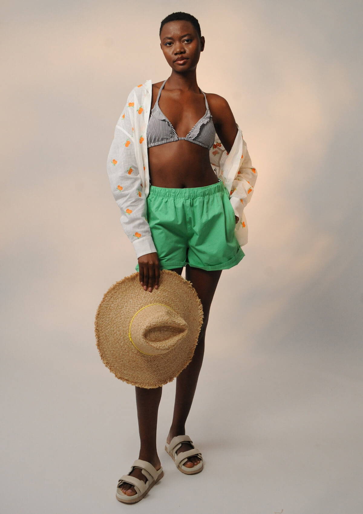 A campaign image of a model wearing a beach getaway look.
