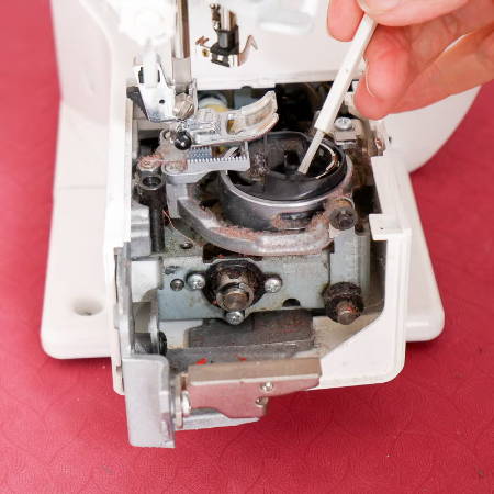 dusty sewing machine interior