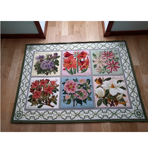 Six panel needlepoint carpet with green trellis border