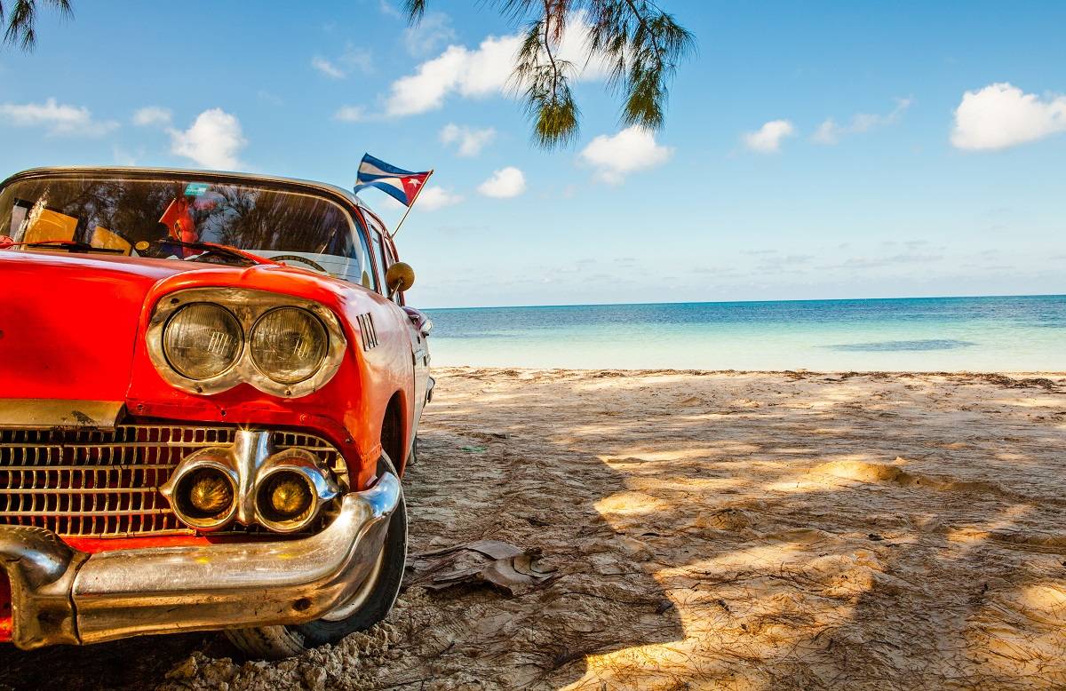 Red car with cuban flag