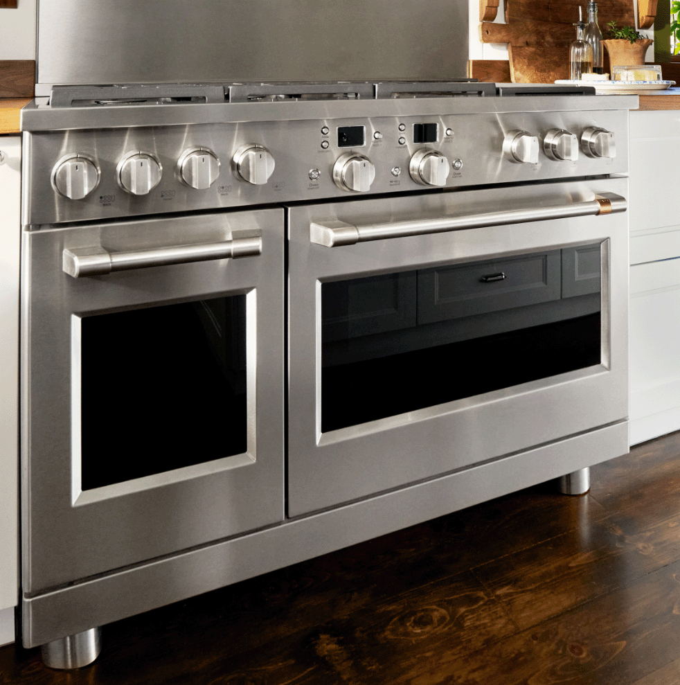 Stainless steel kitchen stove with dual ovens and multiple control knobs.