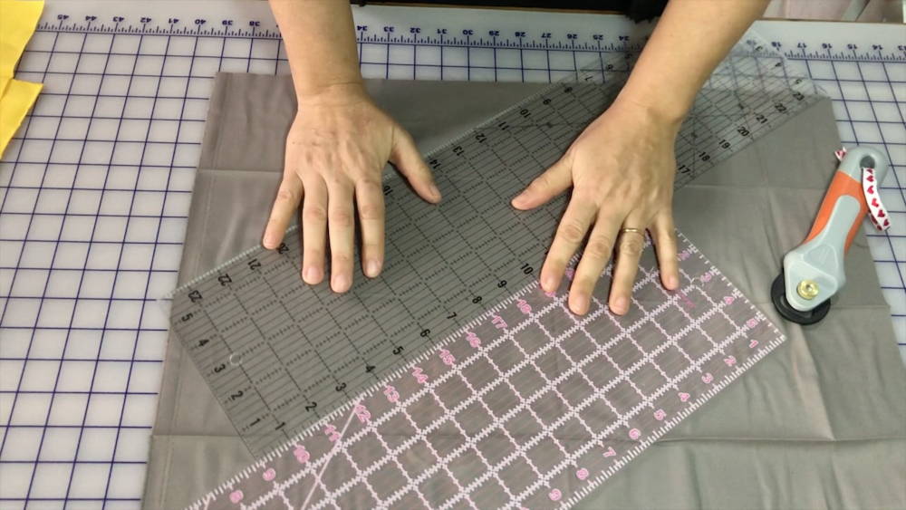 quilt ruler hack to make your ruler longer for cutting long pieces of fabric