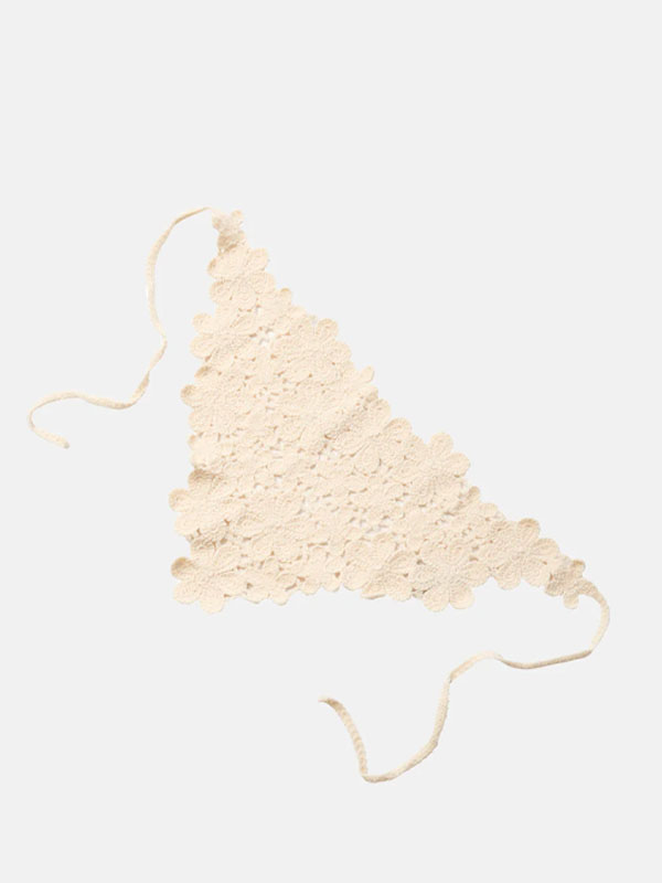 Lace triangle-shaped top with ties, in a light cream color.
