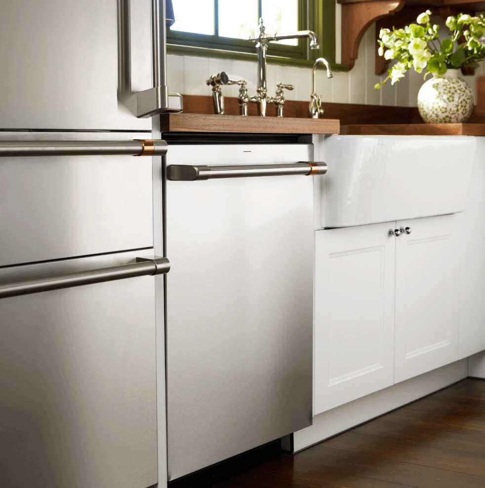 Stainless steel refrigerator and dishwasher in a modern kitchen setting.