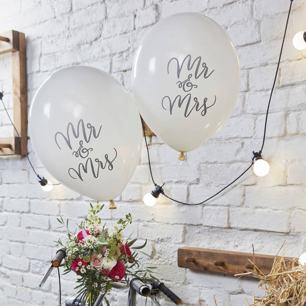 Image of inflated wedding balloons reading Mr & Mrs in silver. Shop all Engagement and wedding decor.