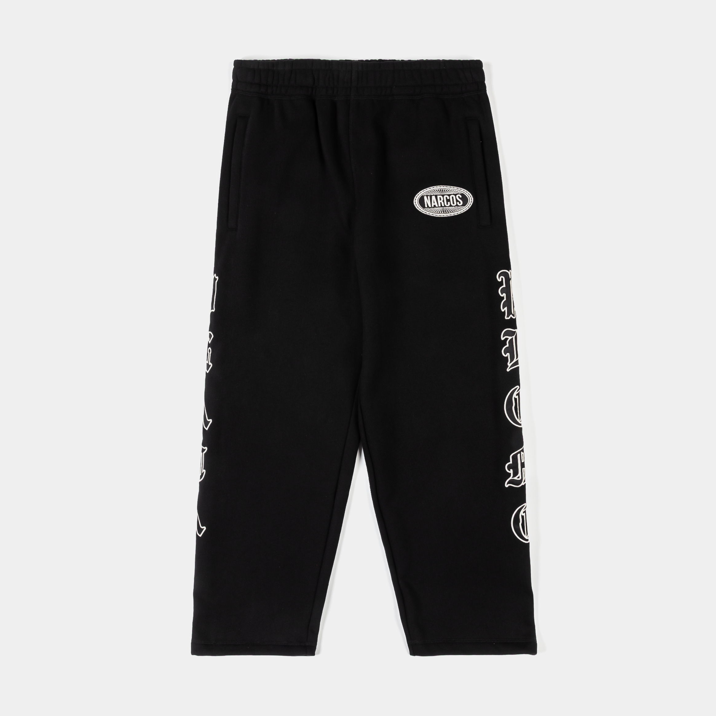 Black pants with a logo and designs on the sides.