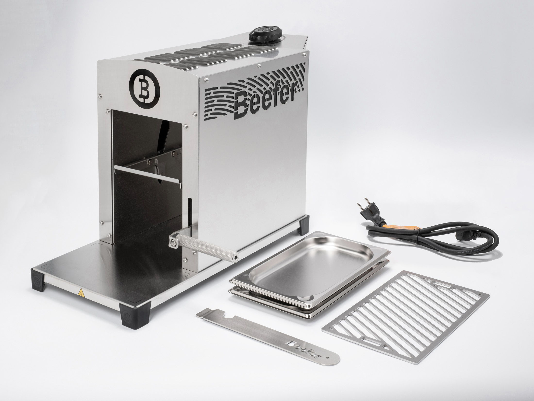 A metal machine with accessories, likely for cooking or heating food.