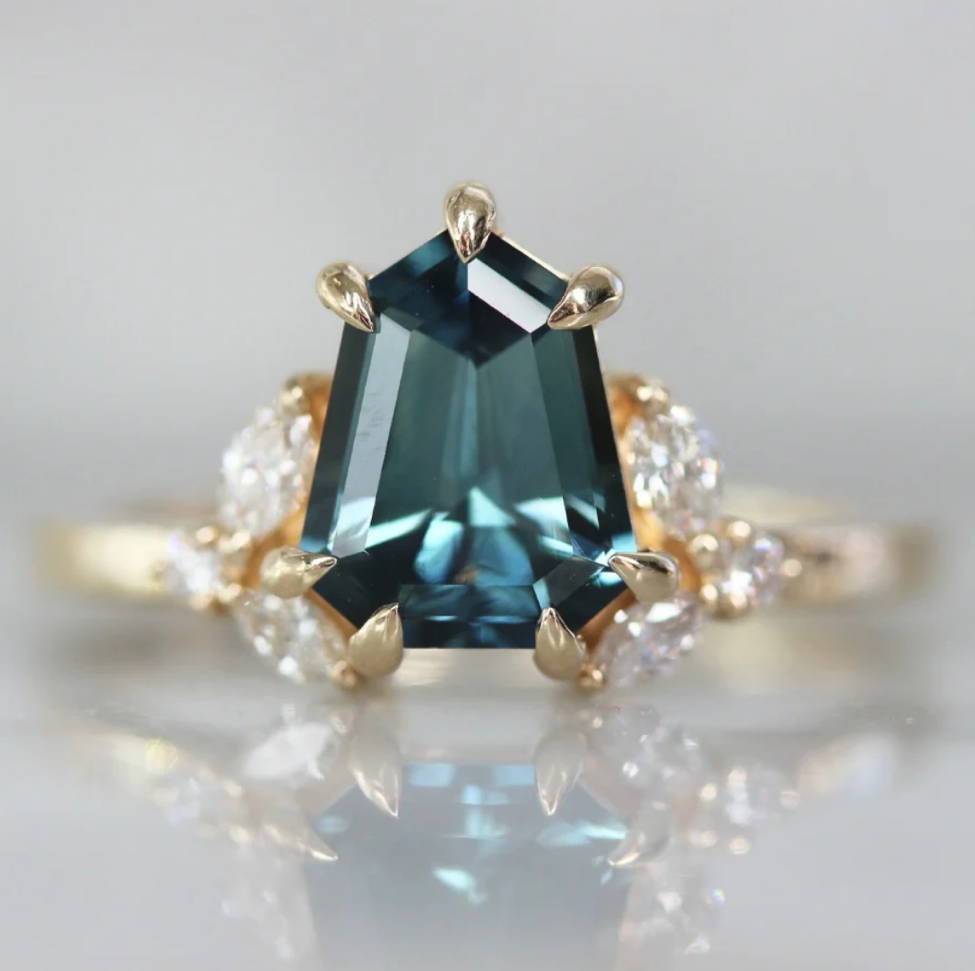 teal shield cut sapphire ring