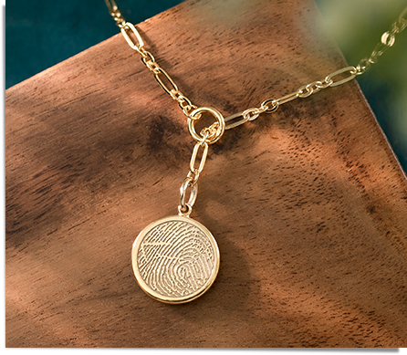yellow gold lariat necklace engraved with a fingerprint